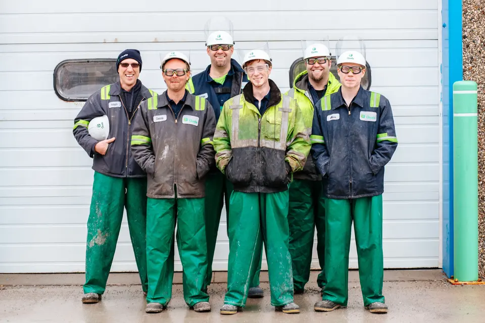 Team of workers in matching safety uniforms